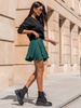 Rozkloszowana mini SPÓDNICA z asymetrycznym dołem zielona X312