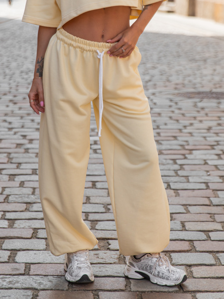 Luźne SPODNIE baggy ze sznurkiem z bawełnianej dresówki niedrapanej od wewnątrz butter yellow jasny żółty X217