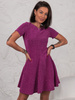Krótka SUKIENKA z rozkloszowanym dołem z dzianiny przeplatanej błyszczącą nitką różowa E608 k01