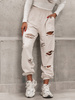 Bawełniane SPODNIE dresowe z dziurami beż melanż D581 k01